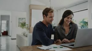 couple using laptop